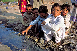 Children playing near sewage in Azamabad district, Pakistan